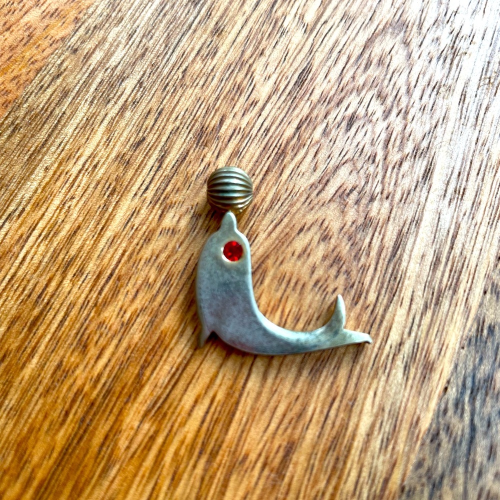 Vintage dolphin pendant , red jewel eye
